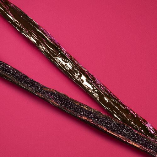 Vanilla beans on a deep ruby background — addictive vanilla absolute base note of Power of You Eau de Parfum by Giorgio Armani.