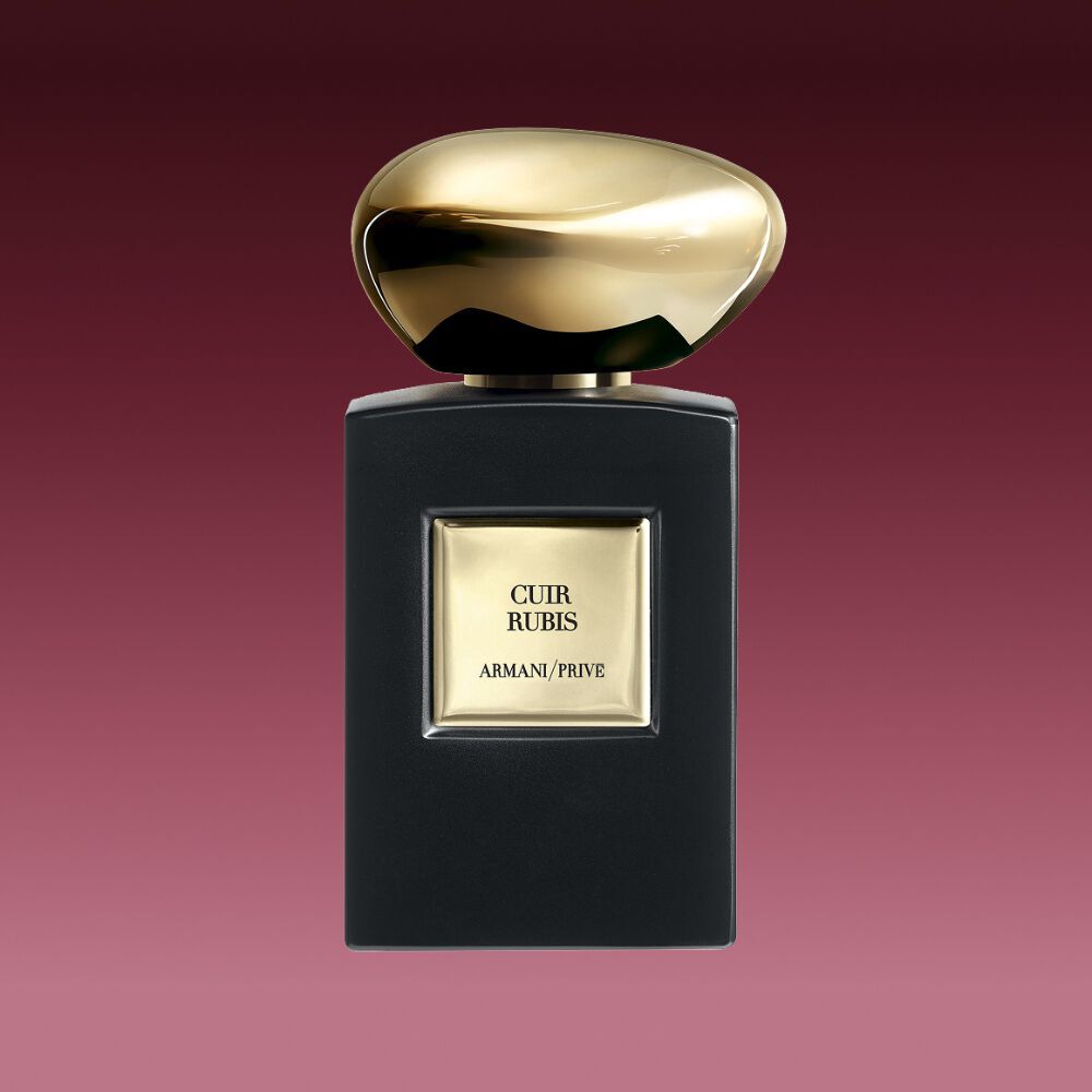 Armani/Prive Cuir Rubis fragrance bottle with matte black finish and precious golden cap.