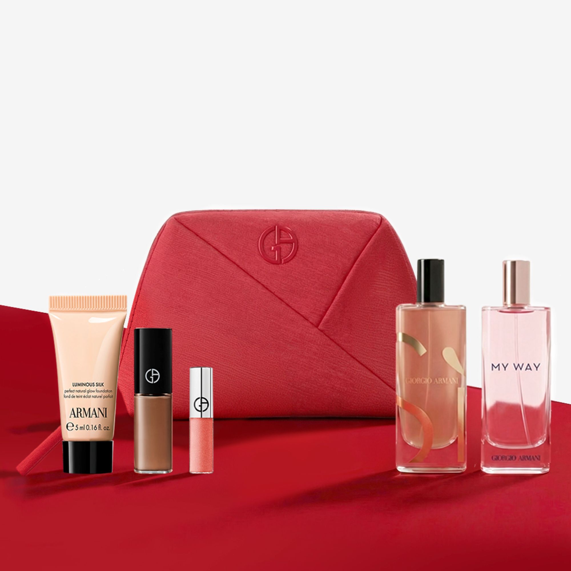 Giorgio Armani beautyset met een rode pouch, parfums en make-up.