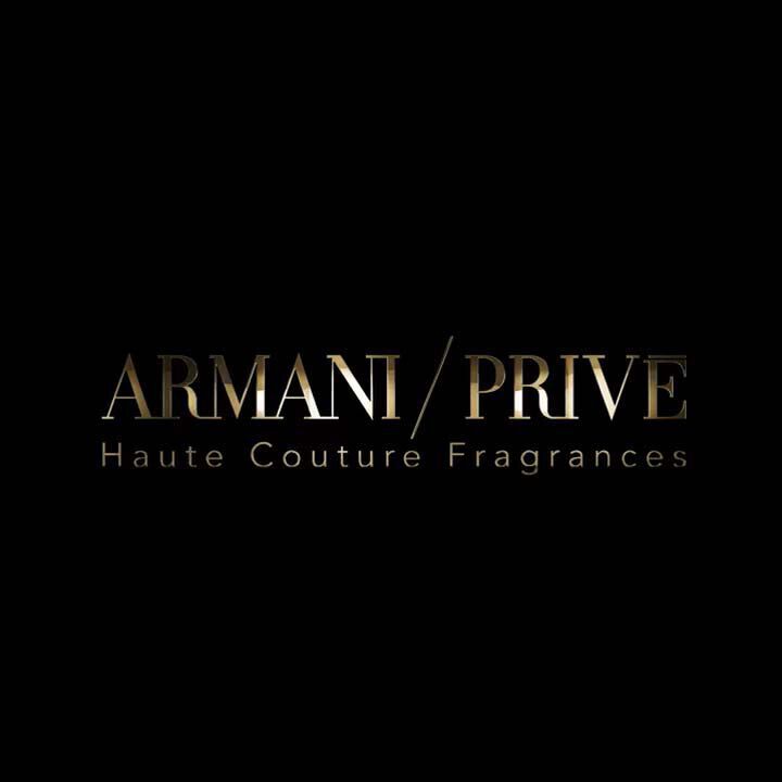 The image features the logo for "Armani Prive Haute Couture Fragrances" displayed in an elegant gold font on a black background.