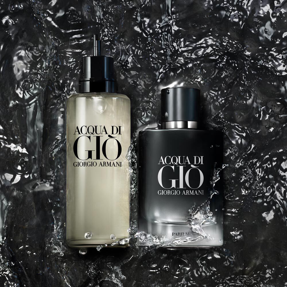 A close-up image of two bottles of Acqua di Gio by Giorgio Armani, featuring a sleek design, placed against a backdrop of water splashes.