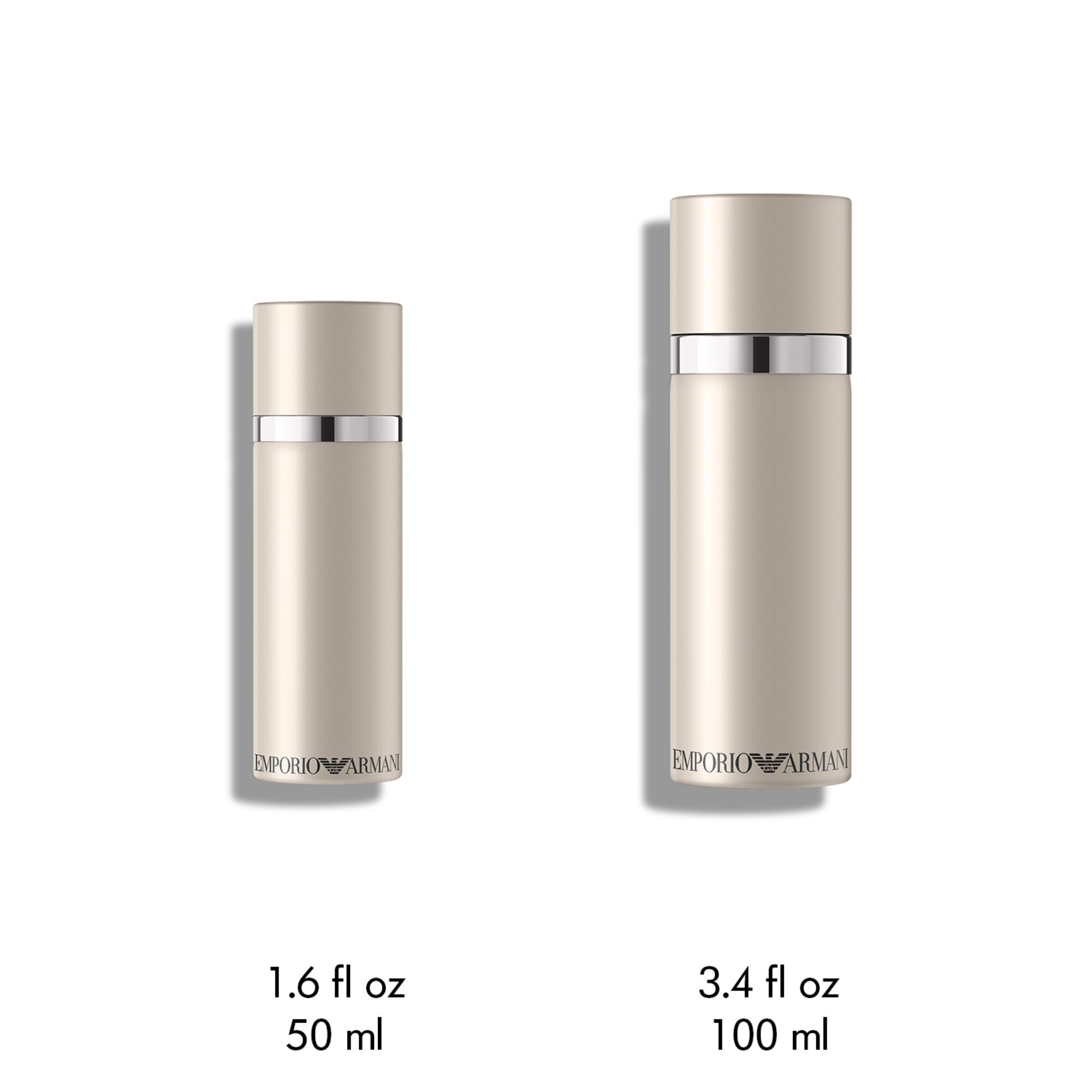 Twee matte lichtbeige cilindrische flessen van Emporio Armani "She" geur, een 50ml en een 100ml, staan samen op een witte achtergrond.