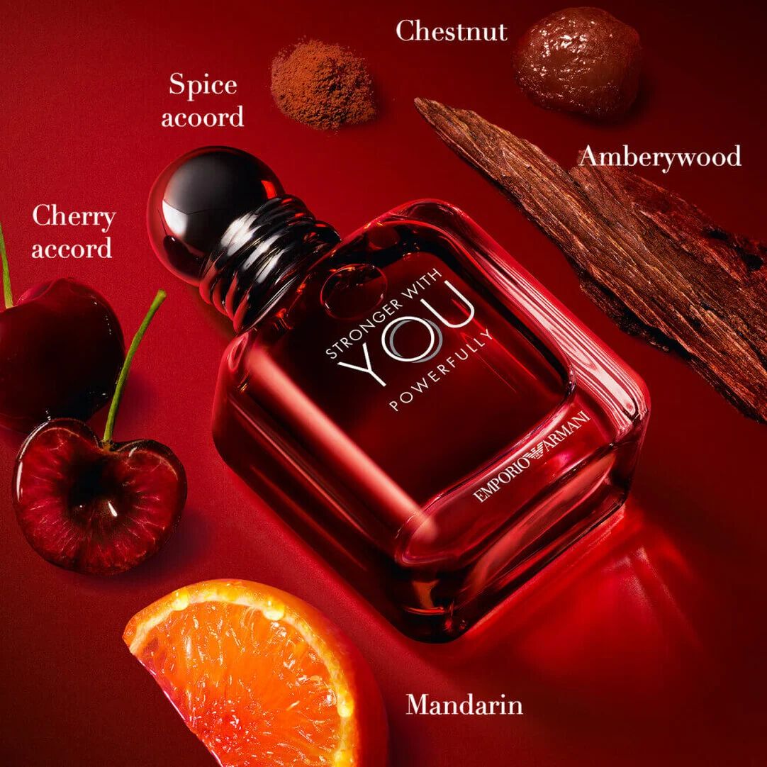 Armani Stronger With You fles, omringd door kersen, sinaasappel, hout en kastanjes.