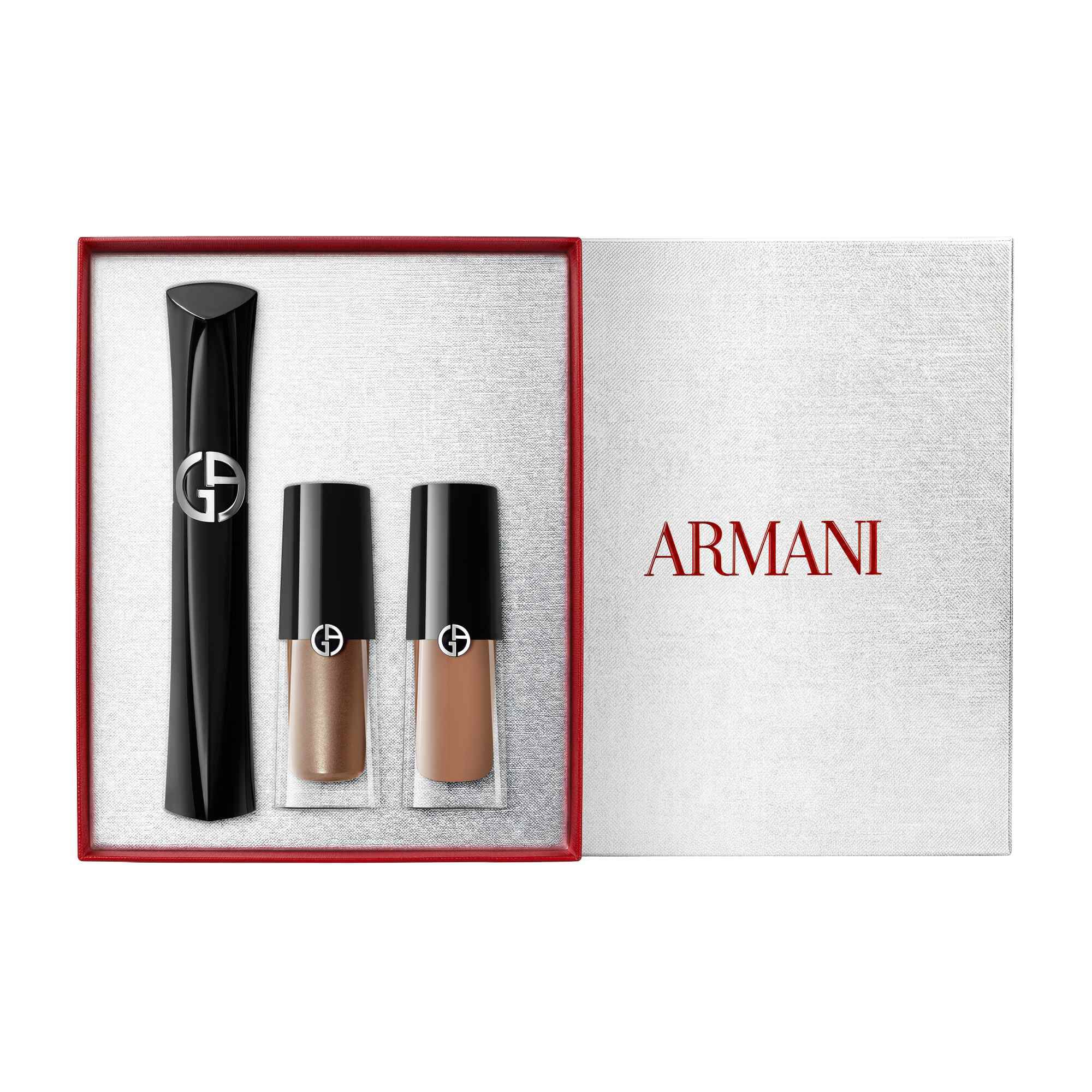 Armani beauty Holiday 2026 open white gift box with red ribbon containing Vertigo mascara and Eye Tint shades 68S Bronzy Brown and 22M Cashew, white background.