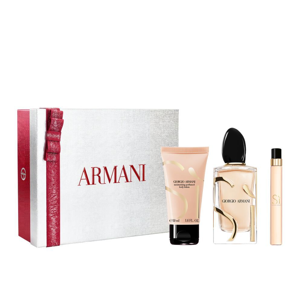 Si Eau de Parfum 100ml, reismaat 10ml en 50ml geparfumeerde bodylotion in een strak goudkleurig flesjetrio, genesteld in een open witte Armani cadeaubox met rood lint — damesgeur-cadeauset.